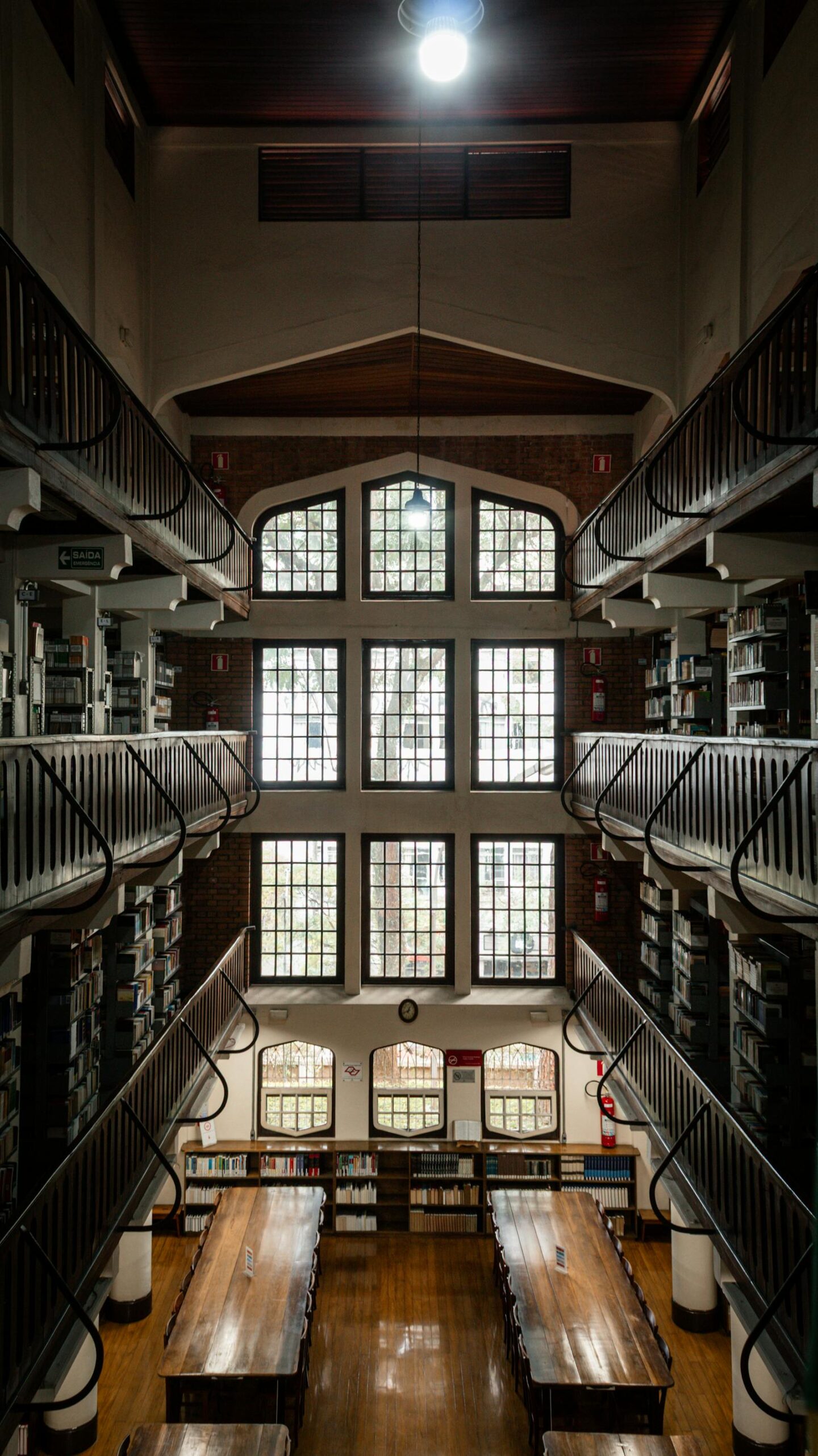 A library interior with bookshelves and study tables